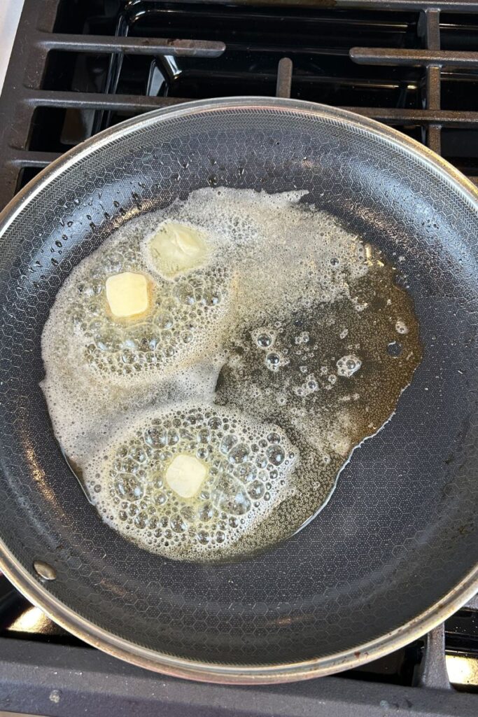 Pan with three table spoons of butter melting and bubbly.