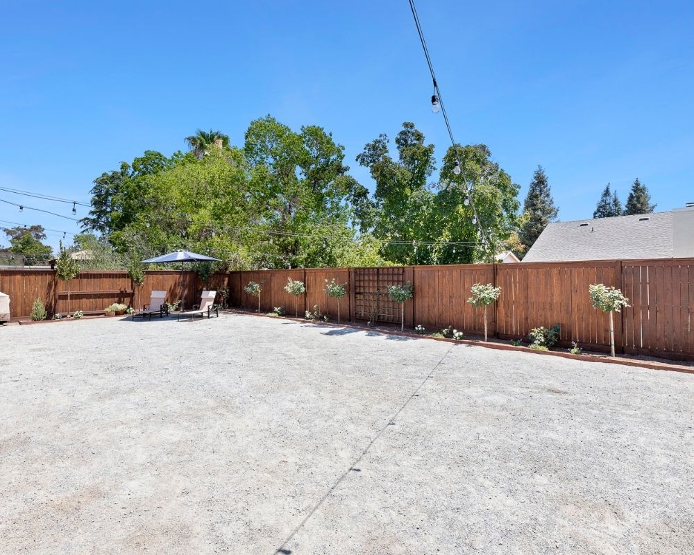 Decomposed granite surface patio and flower beds.