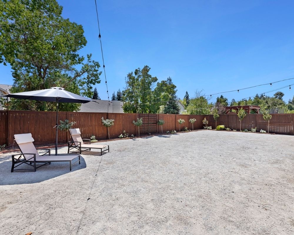 Decomposed granite surface patio and flower beds.