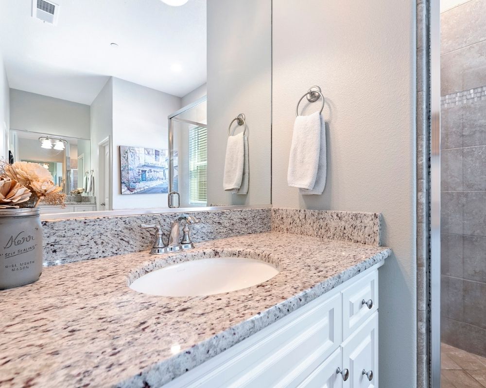 Master bathroom sink vanity and mirror.